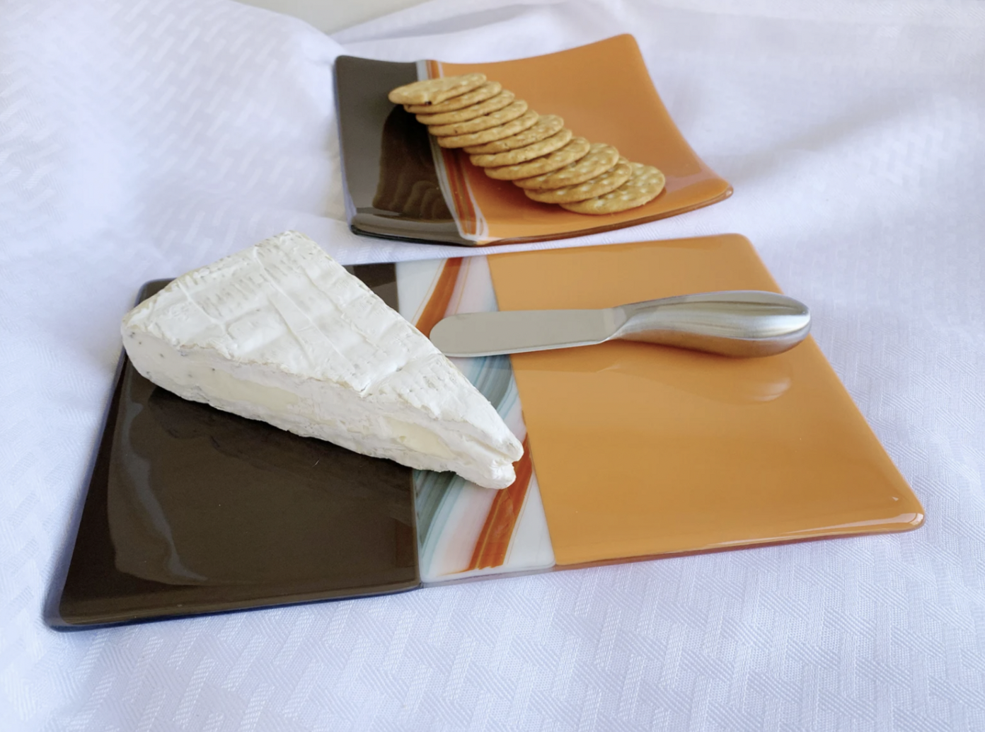 orange brown glass cheeseboard with cracker tray